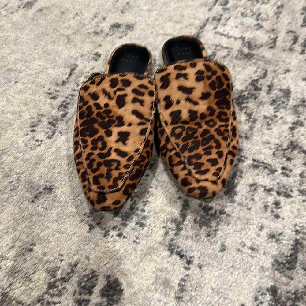 Cheetah print mule slides.